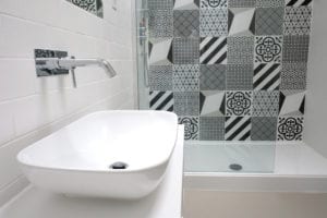 geometric pattern shower curtain and sink