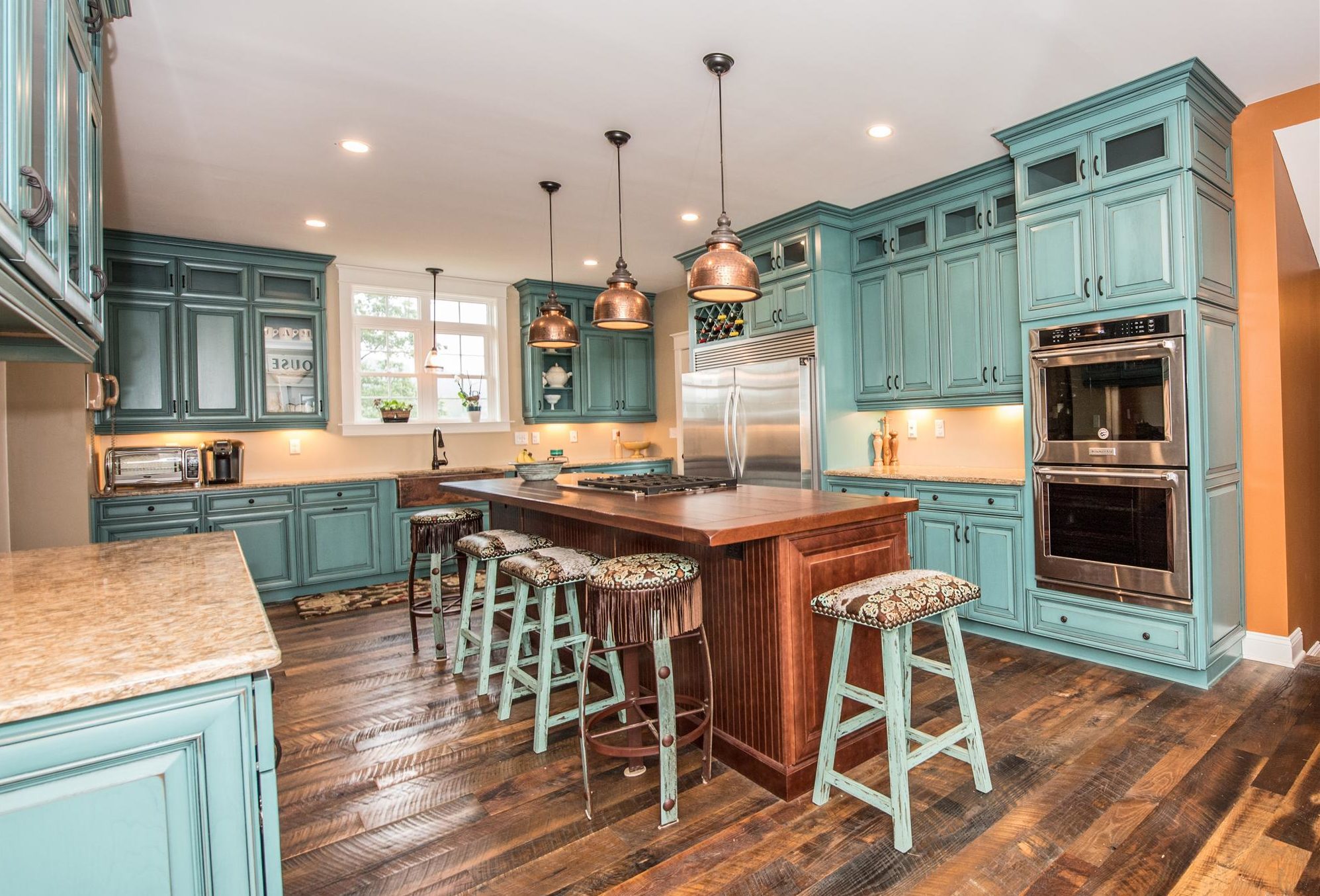 teal-colored kitchen cabinets