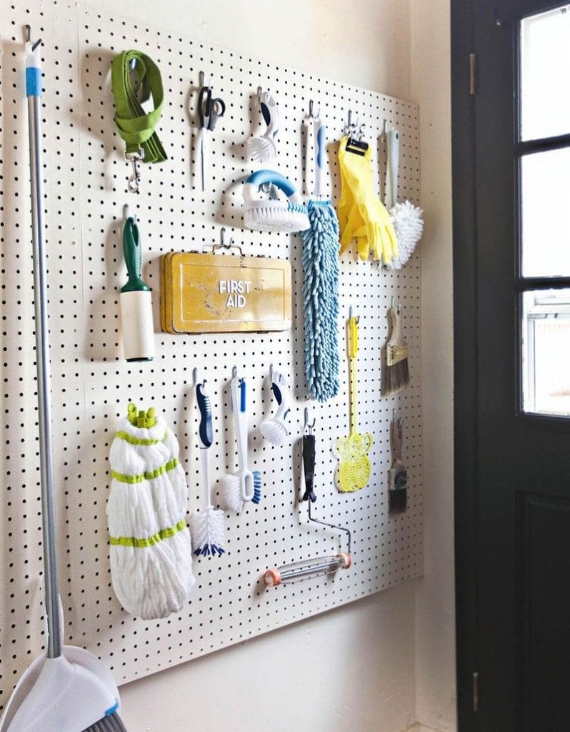 pegboard with cleaning supplies