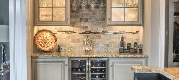 Glasses cleverly organized in kitchen beverage center by Red Rose Cabinetry