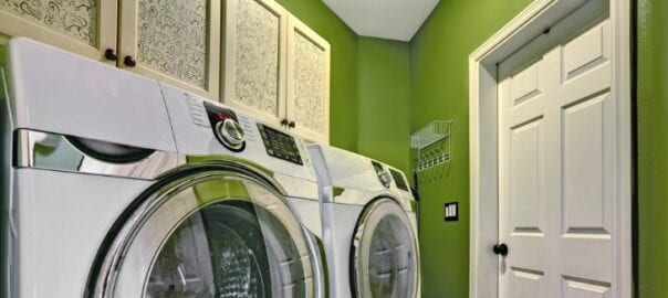 Smaller laundry room with minimal clutter thanks to custom cabinetry