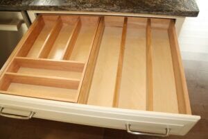 An open drawer with dividers for storing utensils is a great way to optimize your kitchen