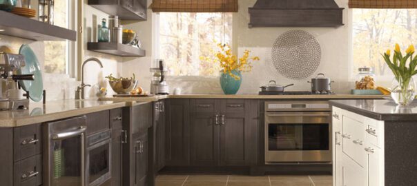 An image of a modern kitchen with grey cabinets.